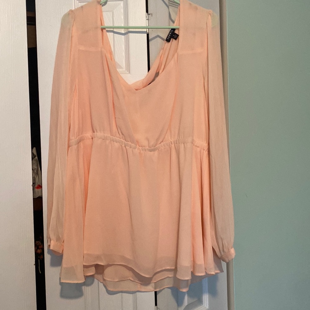 Pink blouse with sheer arms and tie in the upper back